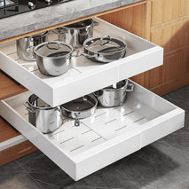 Expandable pull out cabinet organizer for framed cabinets with adjustable width