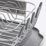 Compact kitchen dish rack with angled drainboard and removable flatware caddy