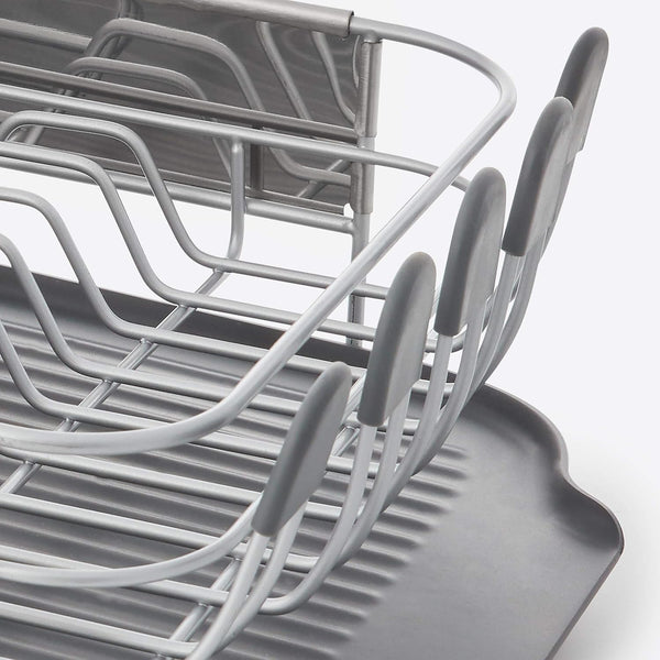 Compact kitchen dish rack with angled drainboard and removable flatware caddy