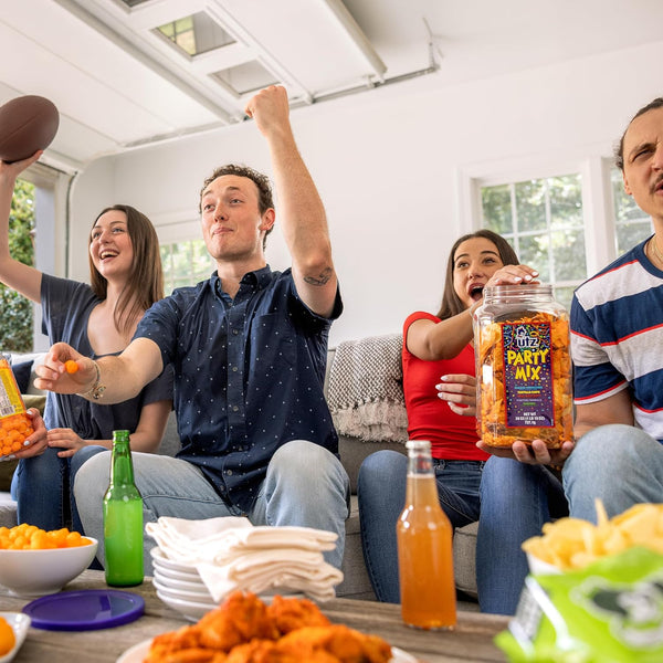 Utz Party Mix snack mix includes corn tortillas, pretzels, and cheese curls, 1.62 pounds, resealable container